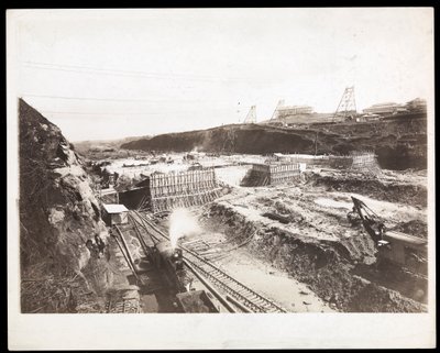 View of construction of the Panama Canal with concrete forms, trains, digging machines and excavations visible, 1912 or 1913 by Byron Company